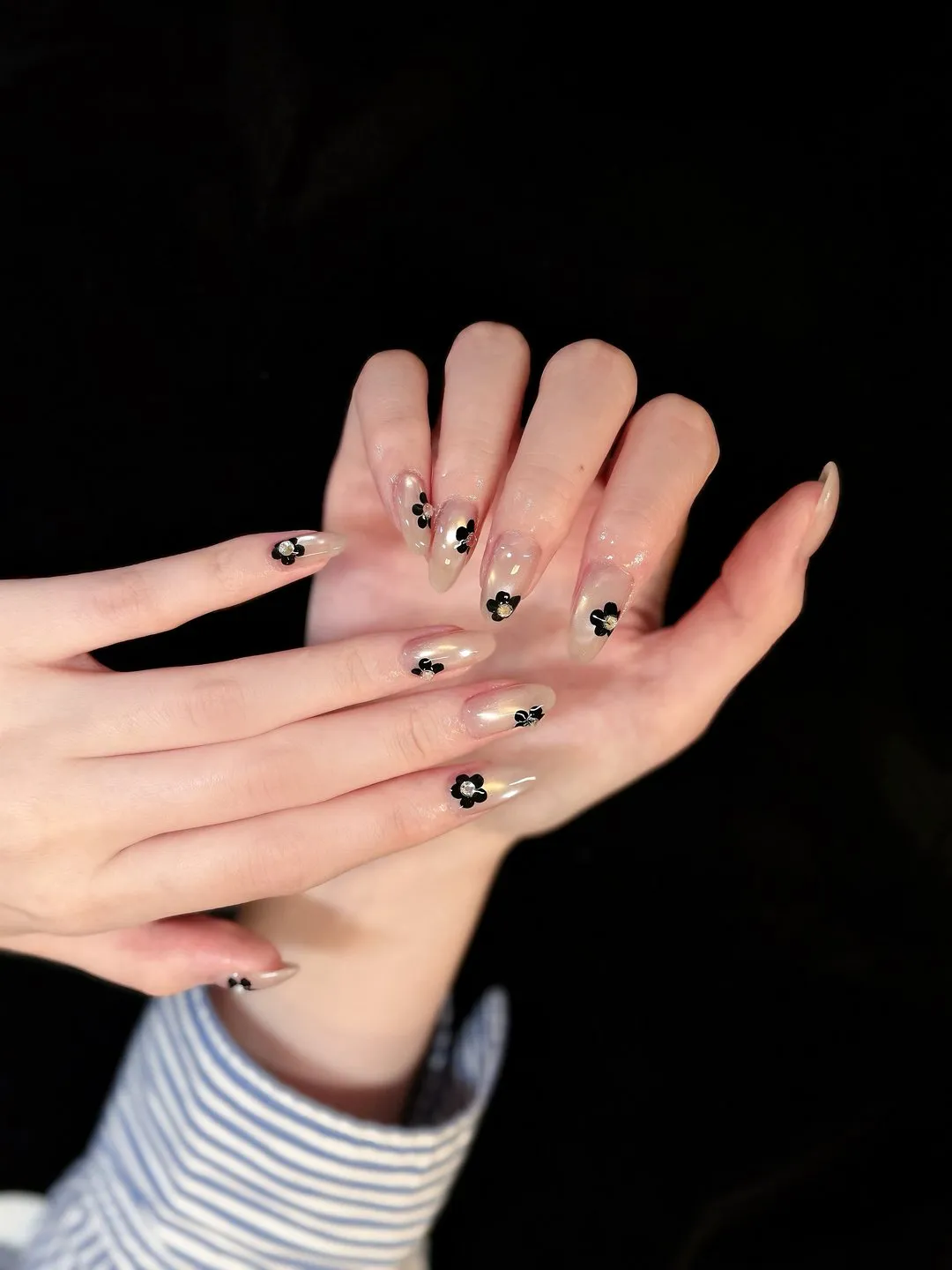 Hand-painted daisy art on bare almond at L2 Nail Salon Mountain View